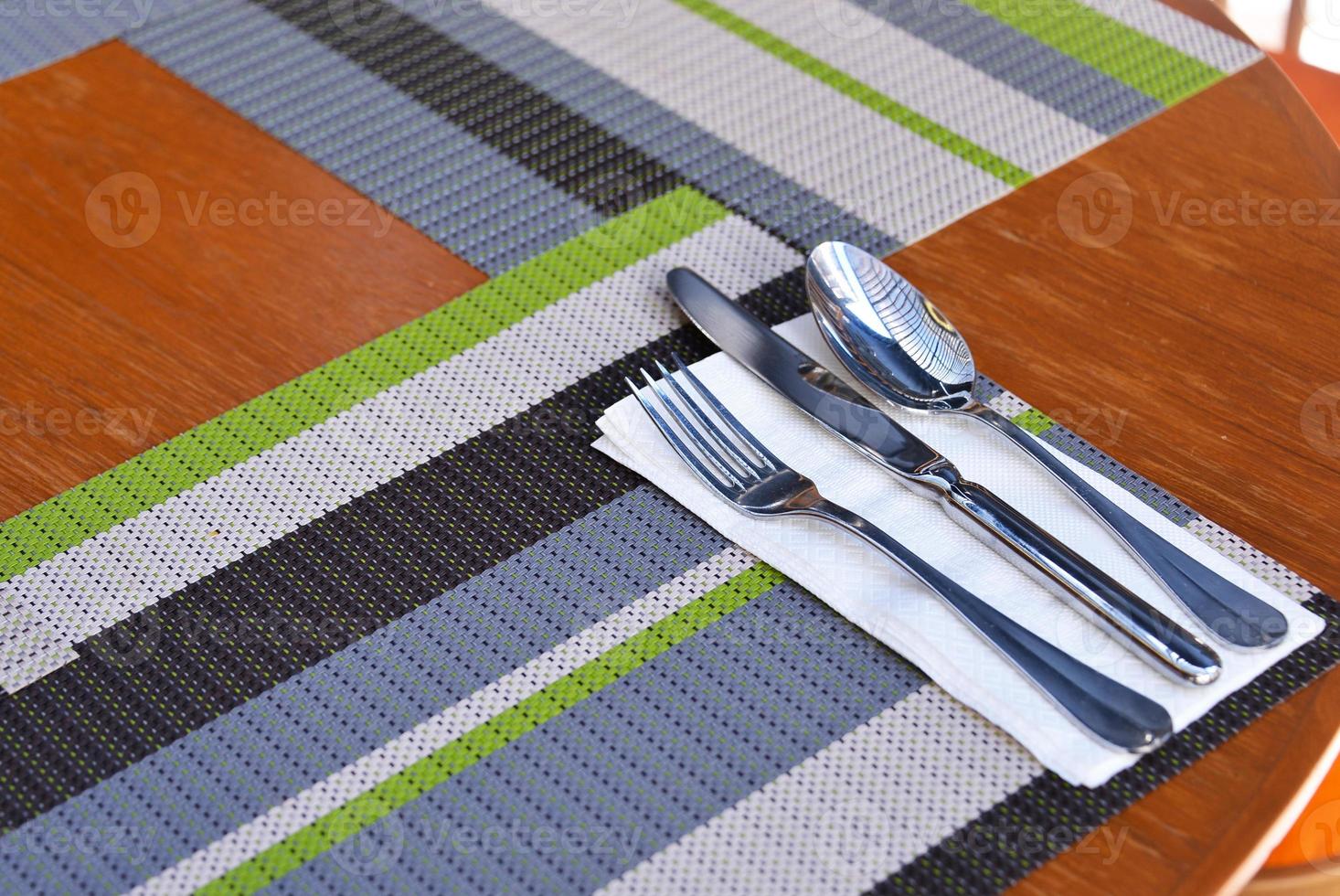 a set of cutlery arranged on table photo