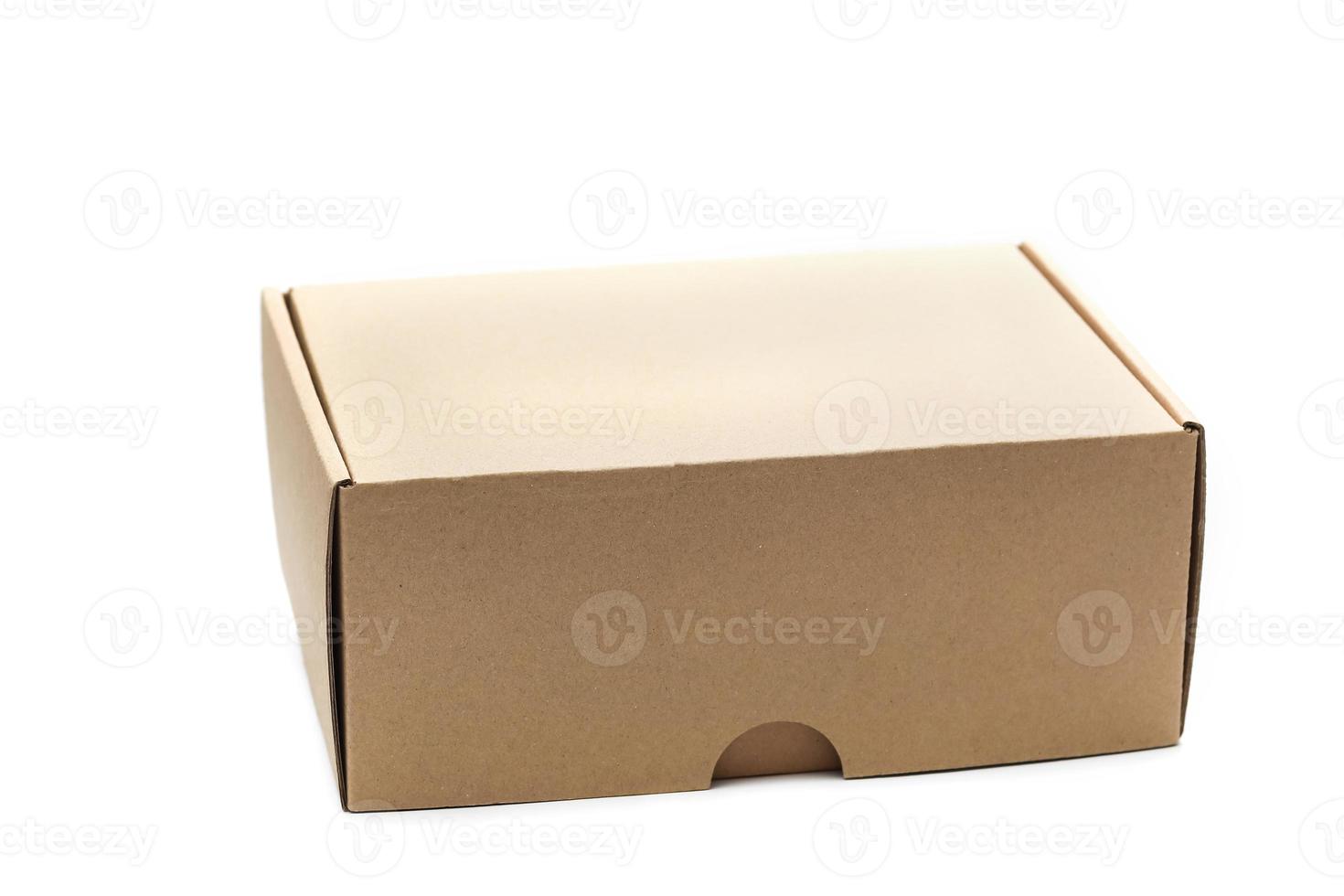 Closed empty cardboard box isolated on a white background photo