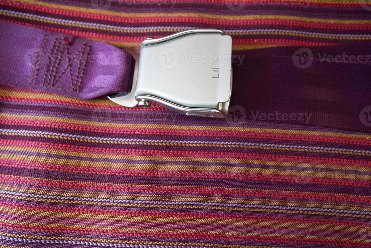 Close up seat belt on airplane photo