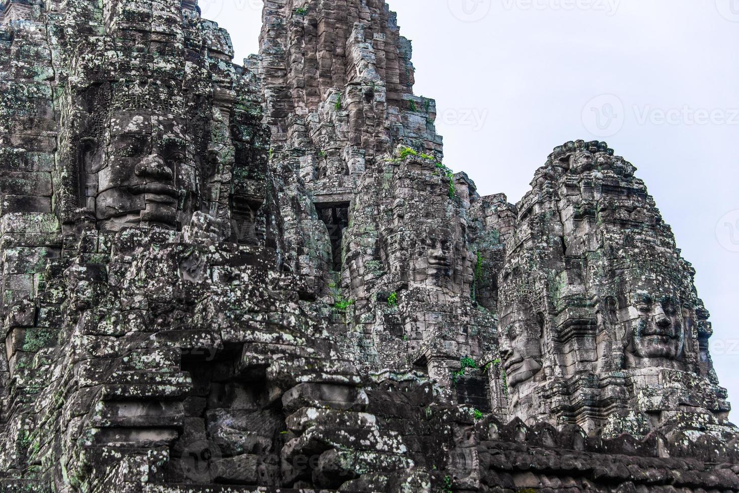 Prasat Bayon with smiling stone faces is the central temple of Angkor Thom Complex, Siem Reap, Cambodia. Ancient Khmer architecture and famous Cambodian landmark, World Heritage. photo