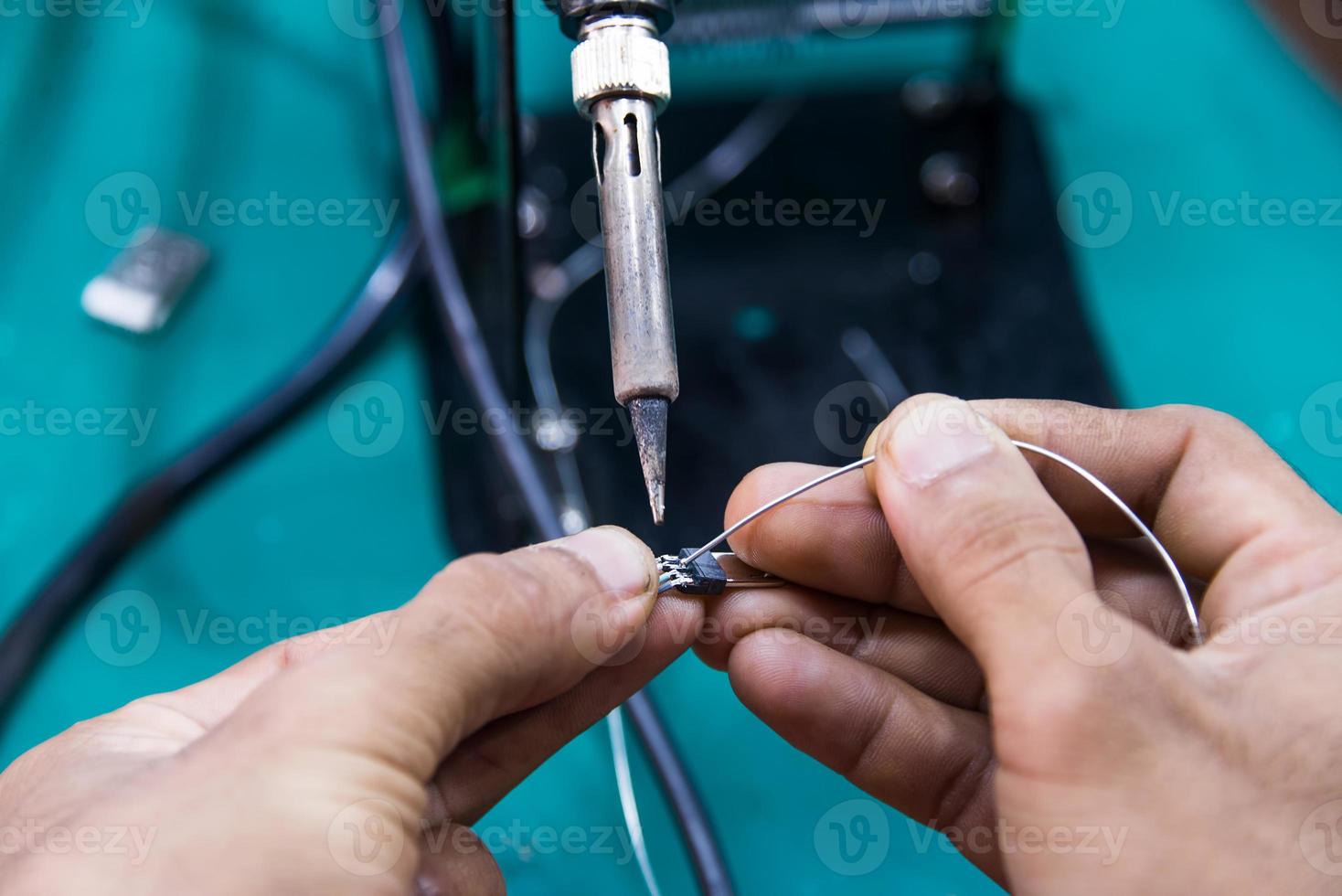 working is soldering cable photo