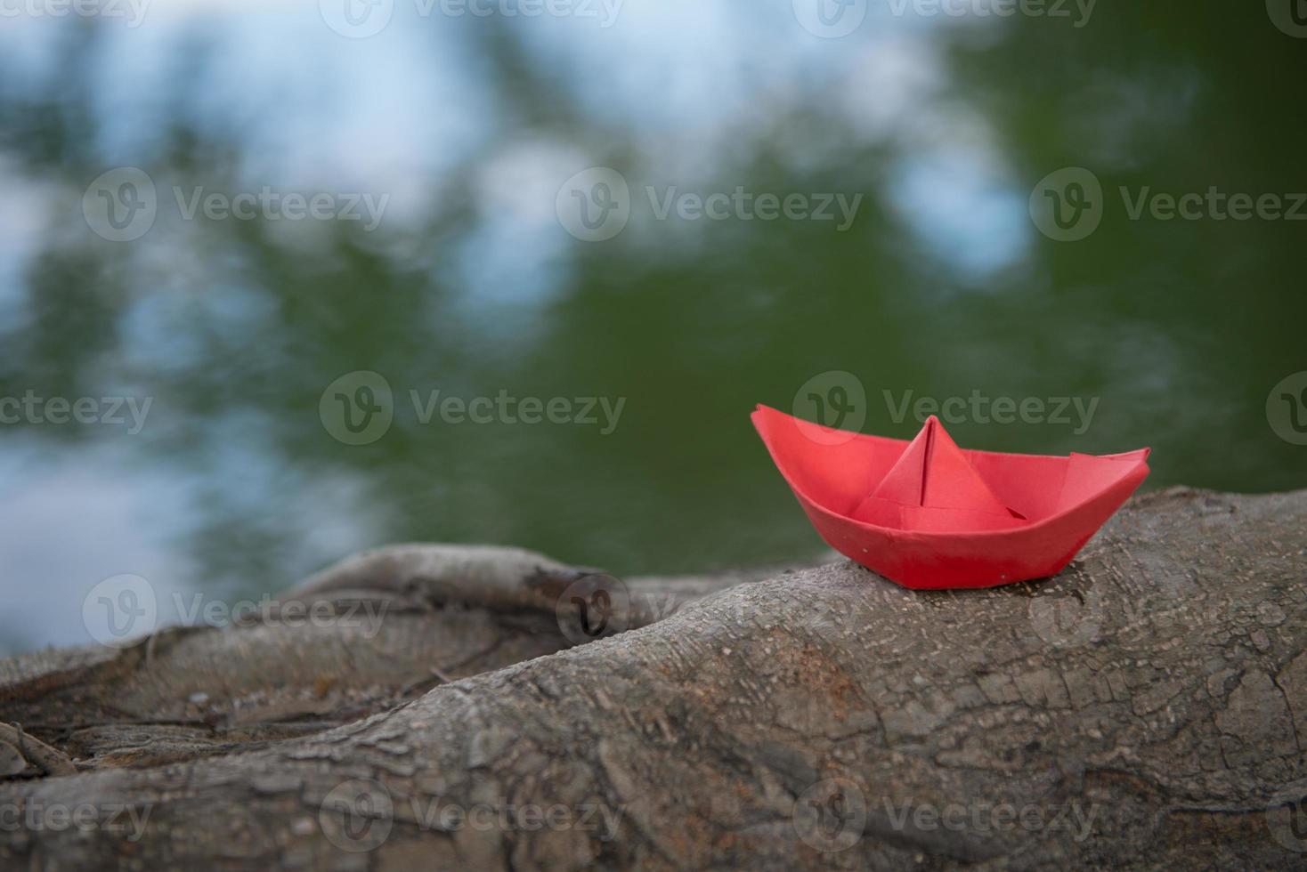 Red paper boat or Origami with nature photo