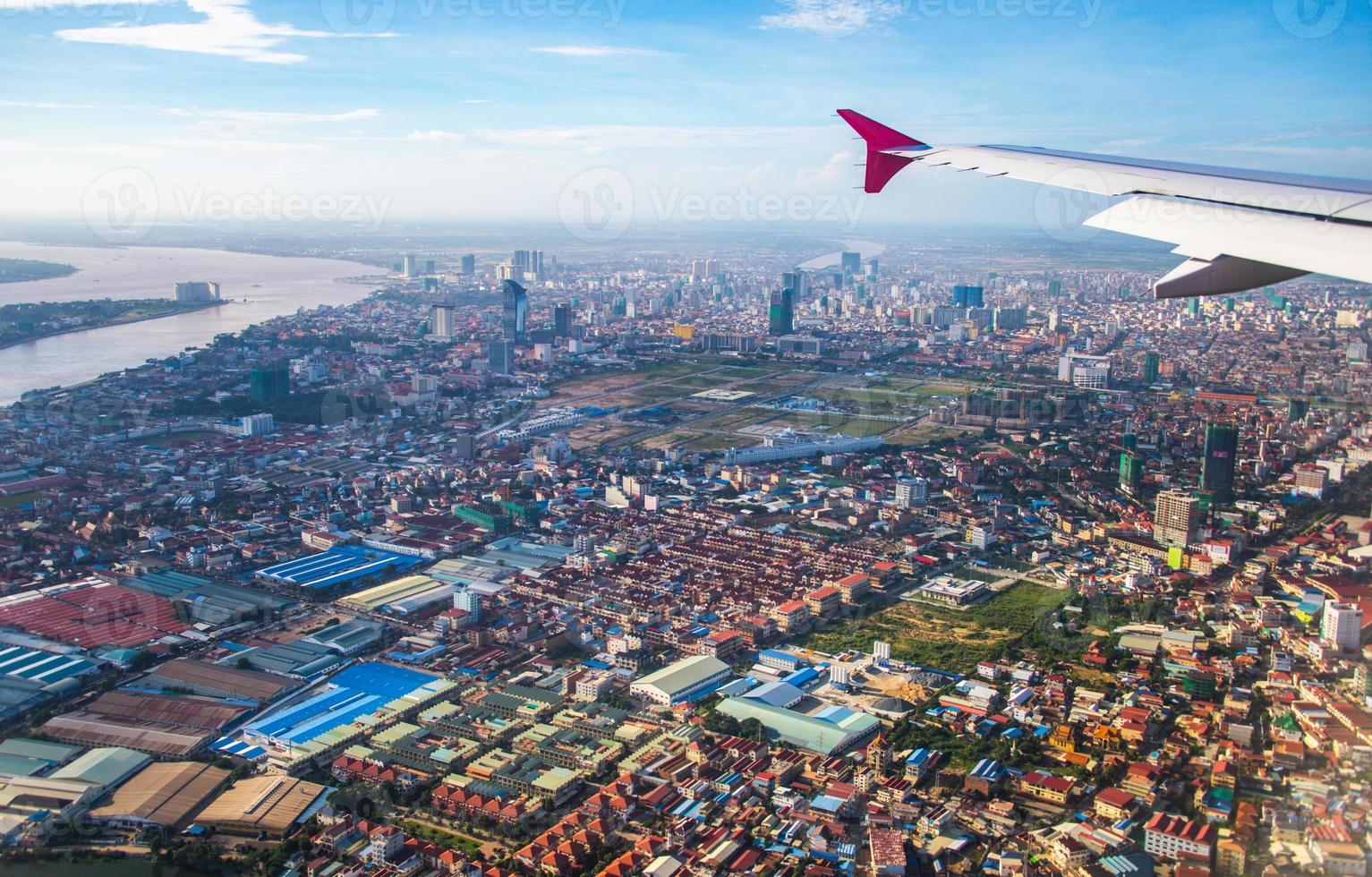 The cityscape view of Phnom Penh City from the window of airplane photo