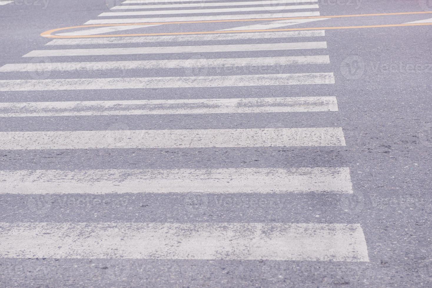 old zebra crossing on the road photo