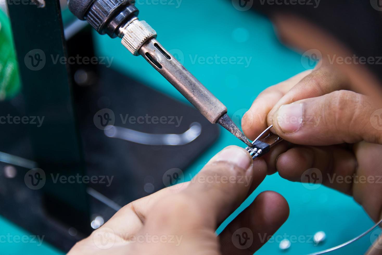 working is soldering cable photo