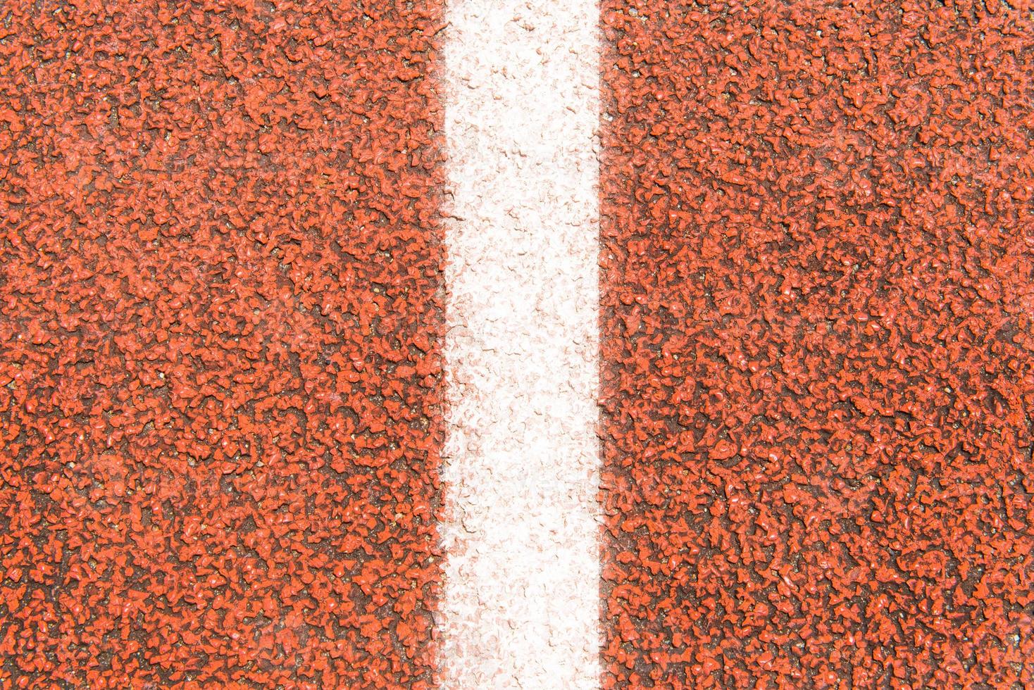 The surface of Running track and white line photo