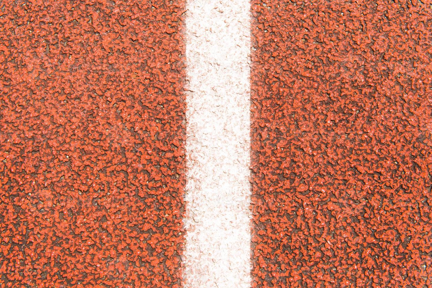 The surface of Running track and white line photo