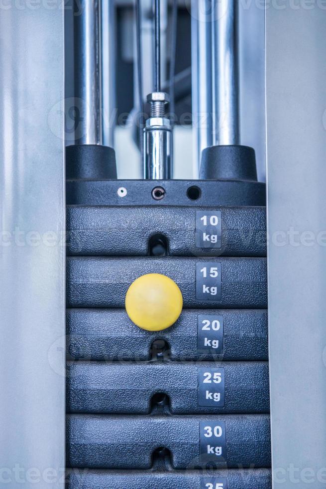 gym weight machine. Amount of weight on lifting machine photo