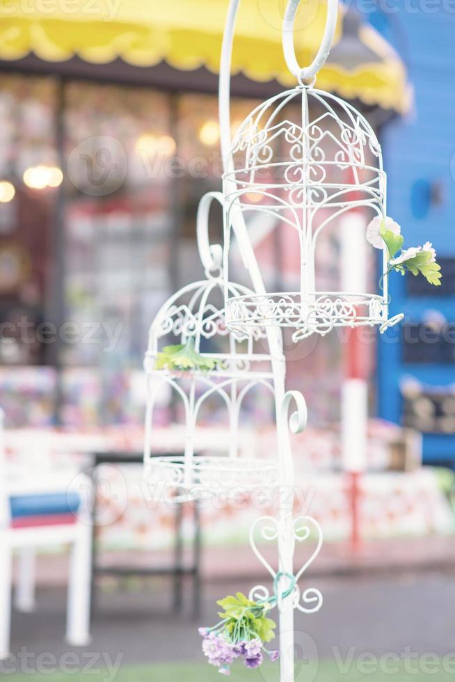 vintage wedding decorative birdcage with flowers photo