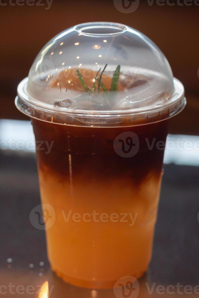 Glass of americano mixed with orange juice photo