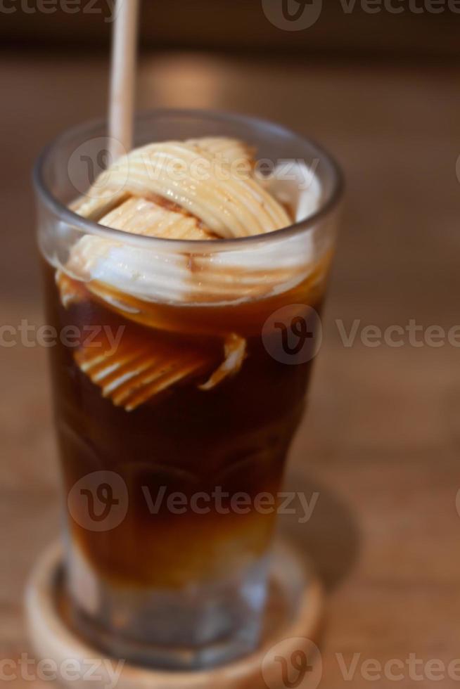 Glass of americano mixed with coconut photo