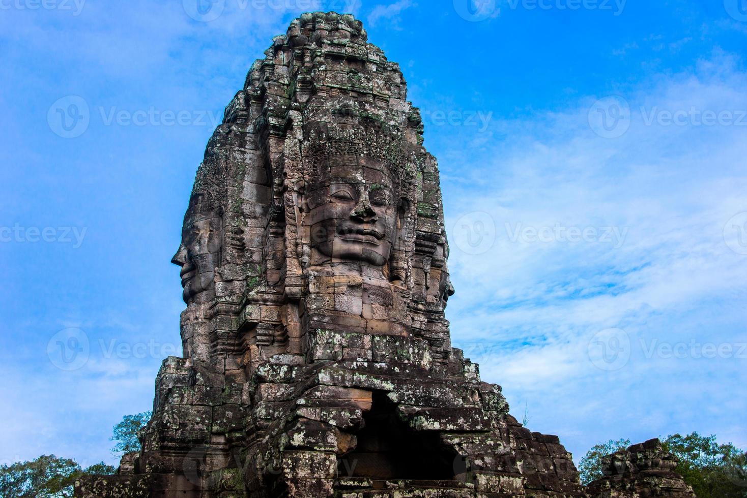 Prasat Bayon with smiling stone faces is the central temple of Angkor Thom Complex, Siem Reap, Cambodia. Ancient Khmer architecture and famous Cambodian landmark, World Heritage. photo