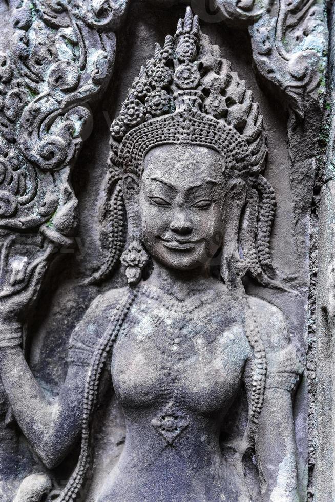 Detail of stone carvings of Apsara is a beautiful and seductive girl of Hindu mythology at Angkor Wat, Cambodia photo