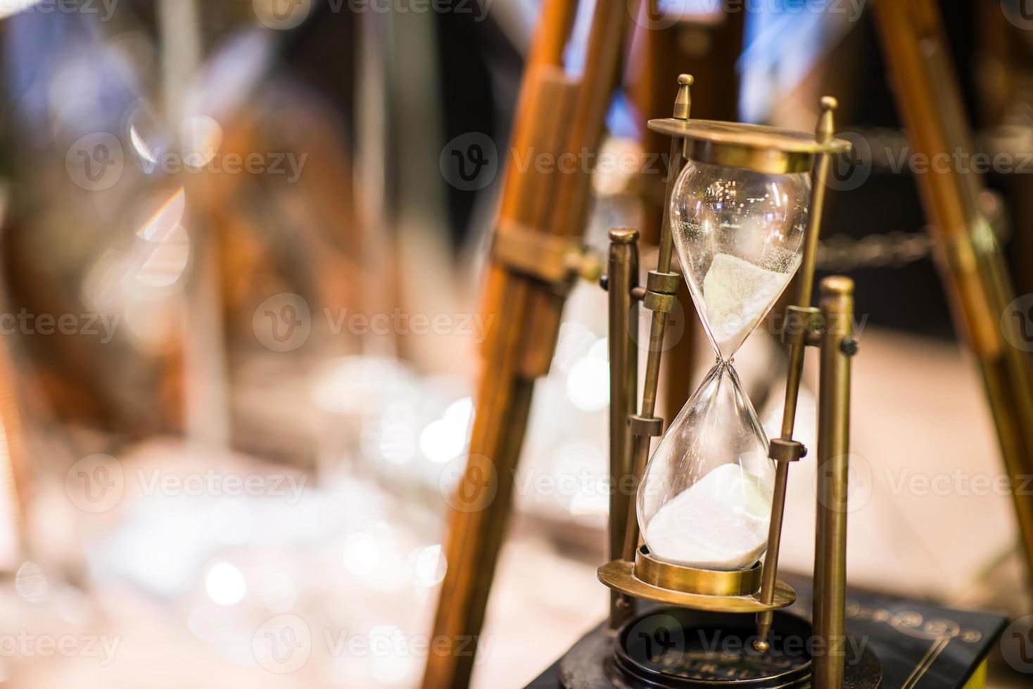Hourglass is passing down, time concept photo