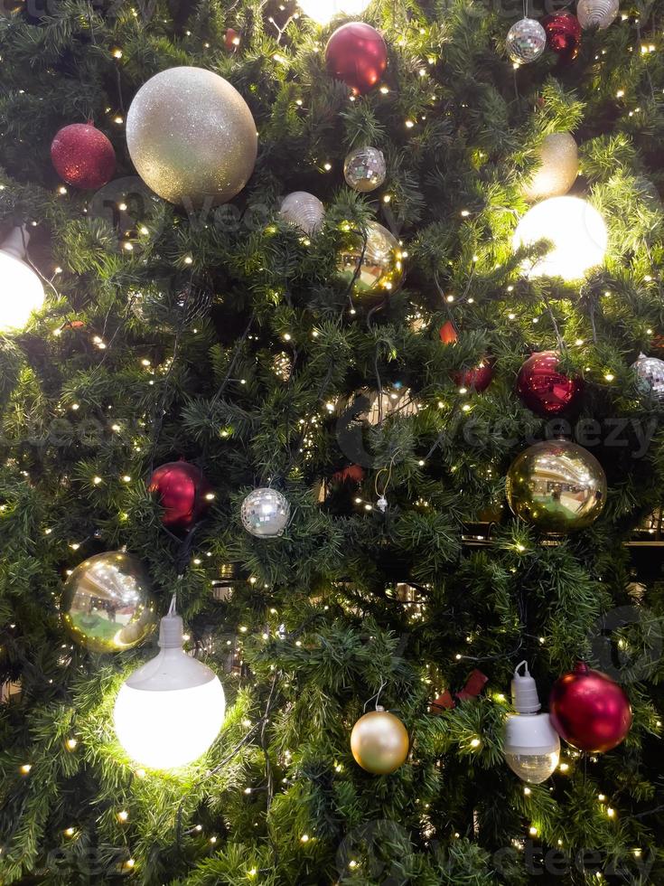 Christmas tree with light bulbs background photo