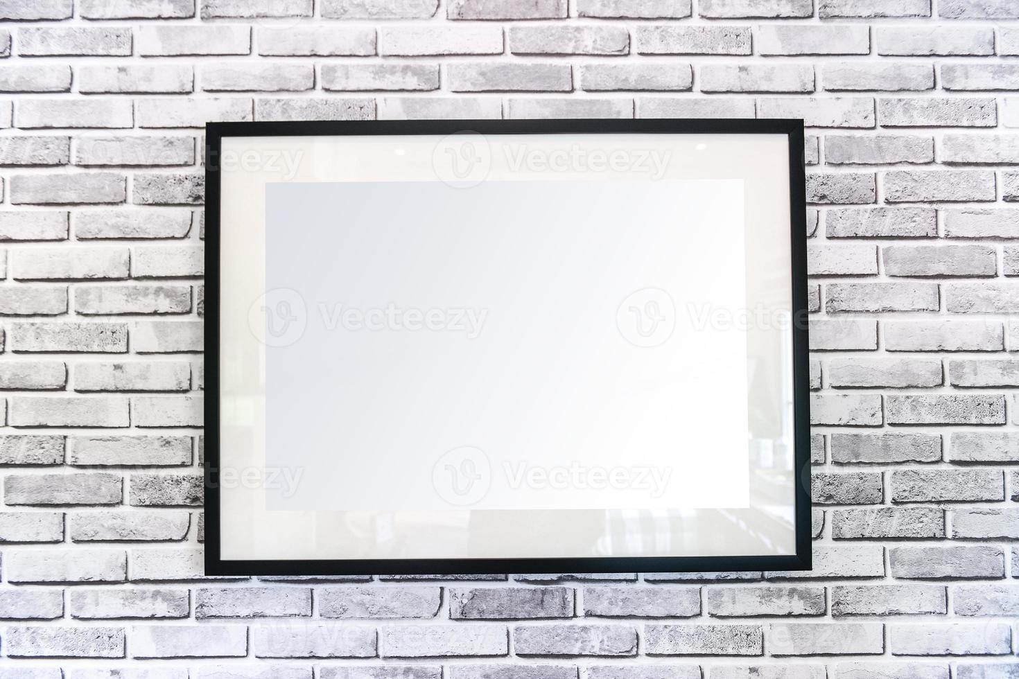 Blank picture frame hanging on wall photo