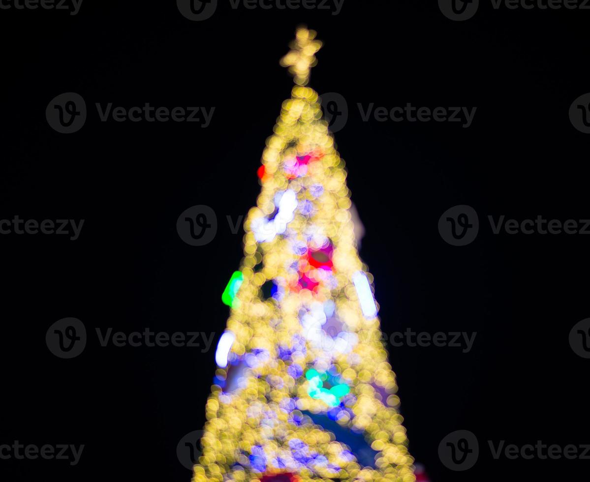 Blurry Christmas tree and decorations and lights photo