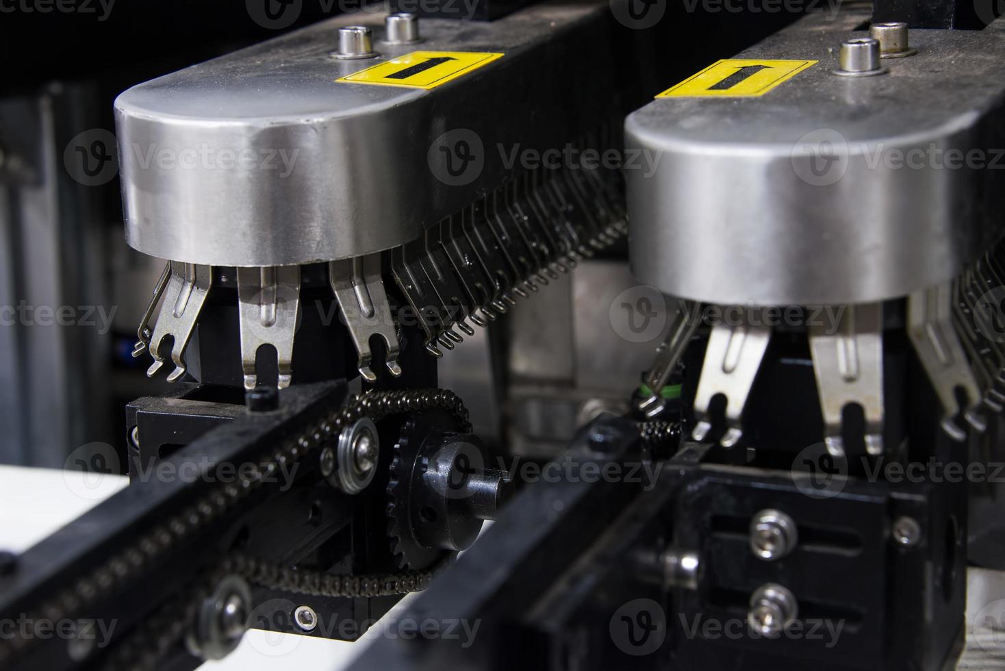 conveyor chain of automatic soldering machine 16695482 Stock Photo at Vecteezy