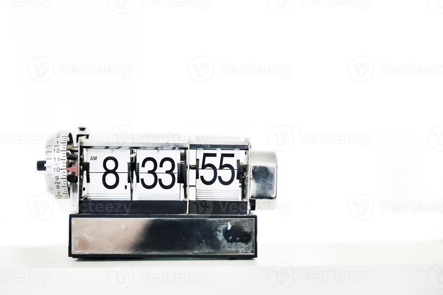 Alarm clock on table photo