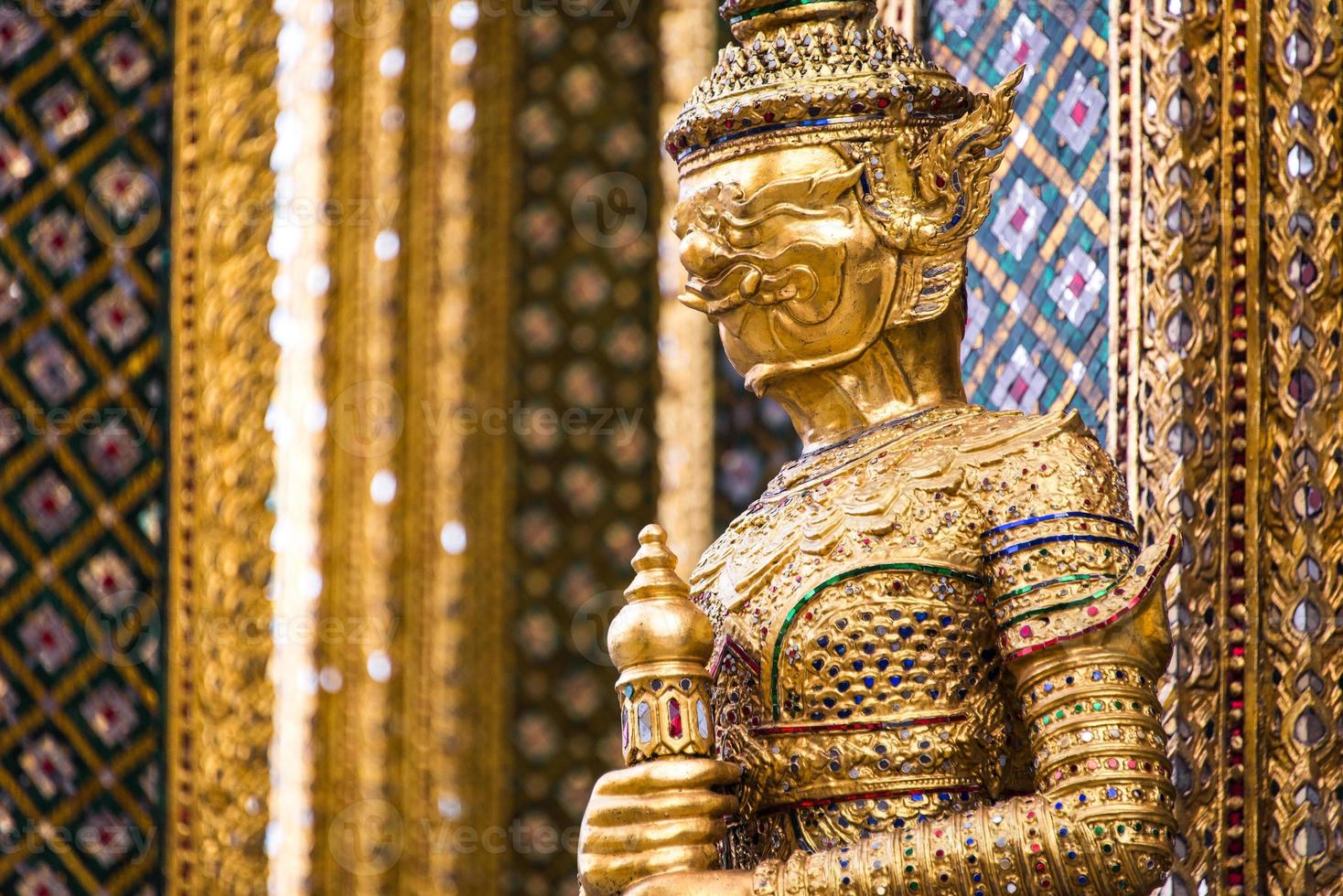 A statue of Yaksa on temple guard at the Temple of the Emerald Buddha, Bangkok, Thailand photo