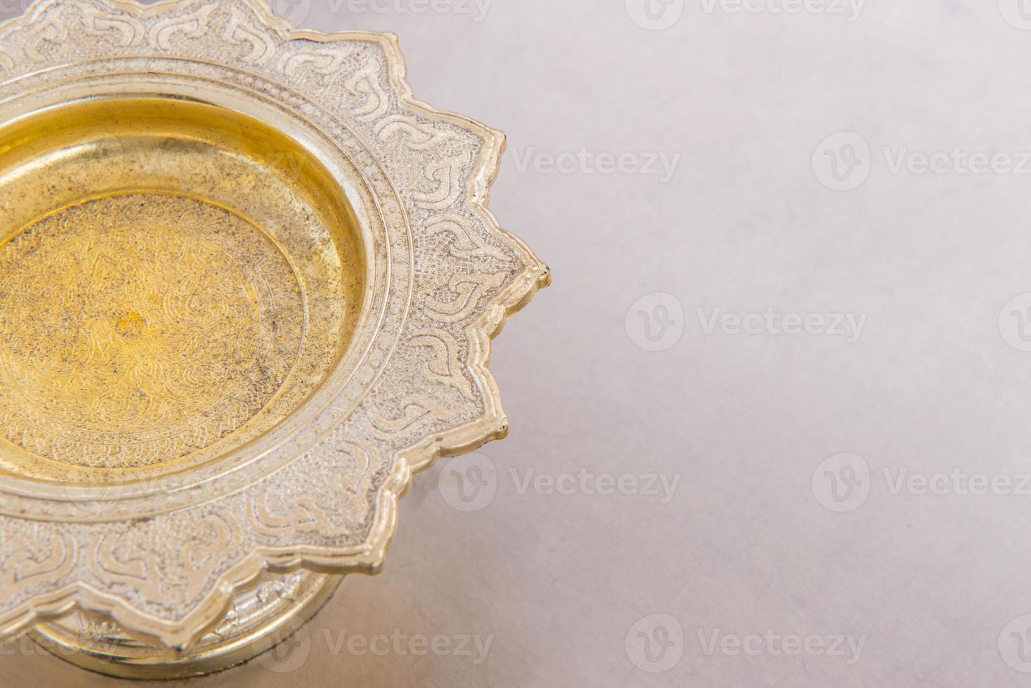 Golden tray in temple and religious ceremony photo