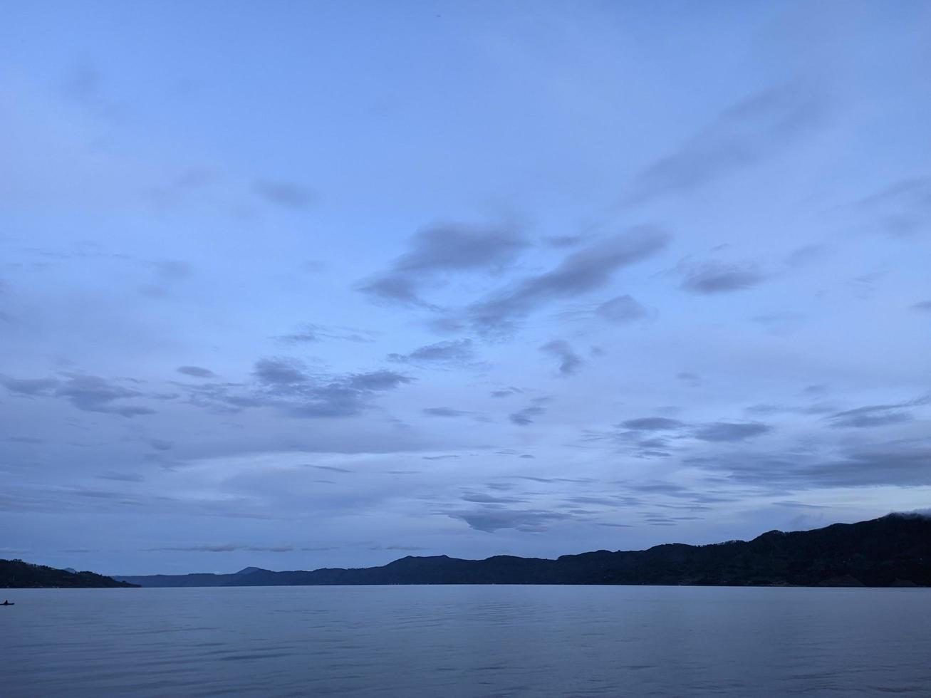 the beauty of the morning sky in lake toba photo