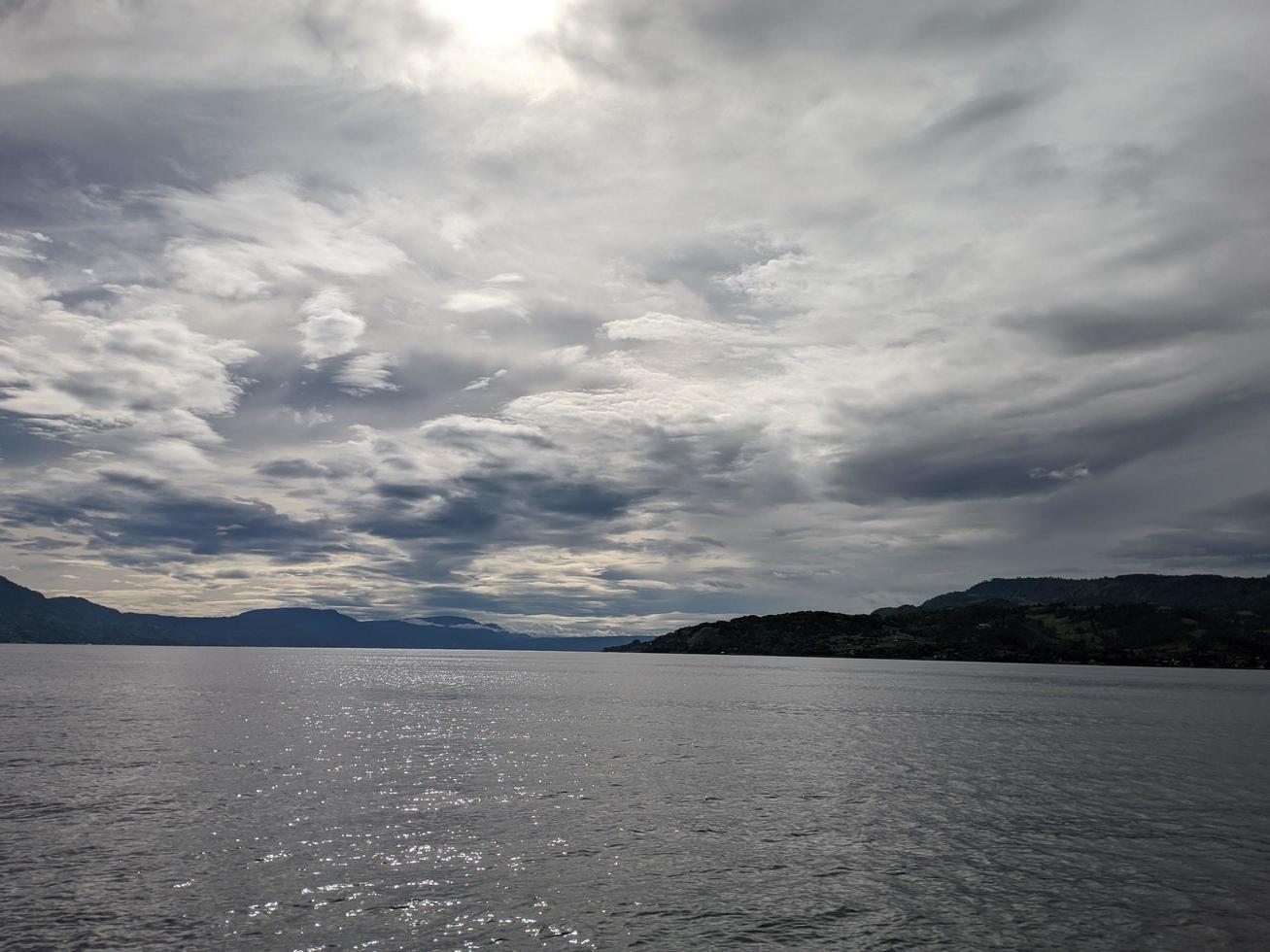 Sunrise in the sky of lake toba photo