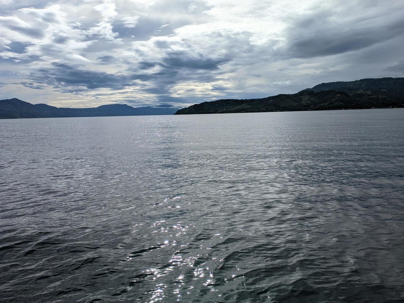 the beauty of the morning sky in lake toba photo