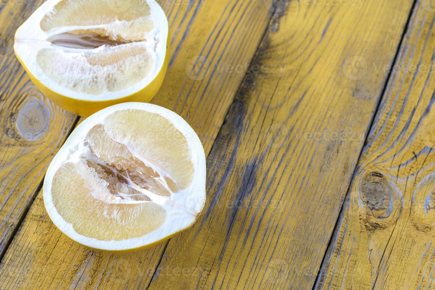 Pomelo on the wooden table photo