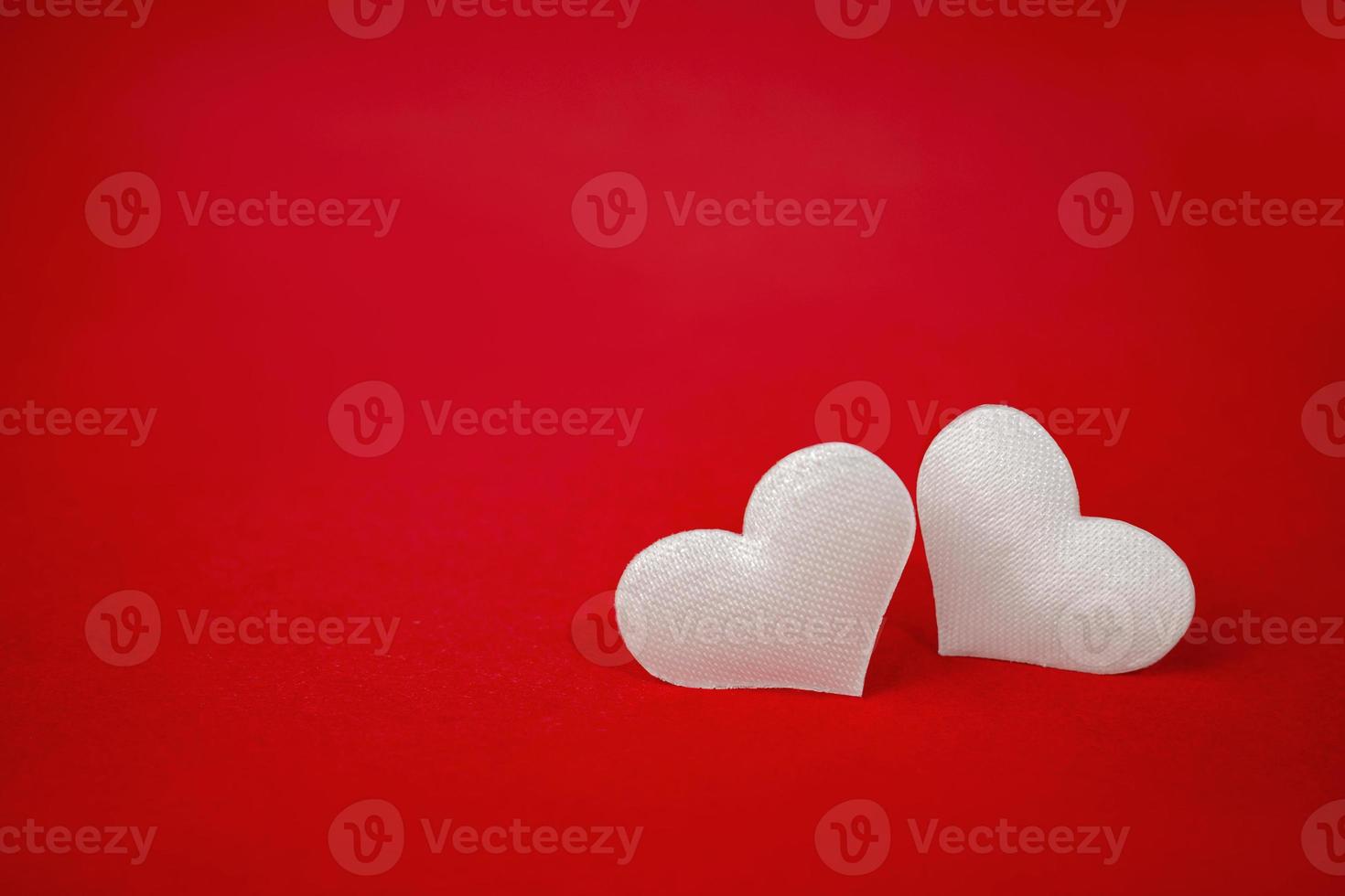 Two white hearts on a red background. Valentine's day holiday. Symbol of love. photo