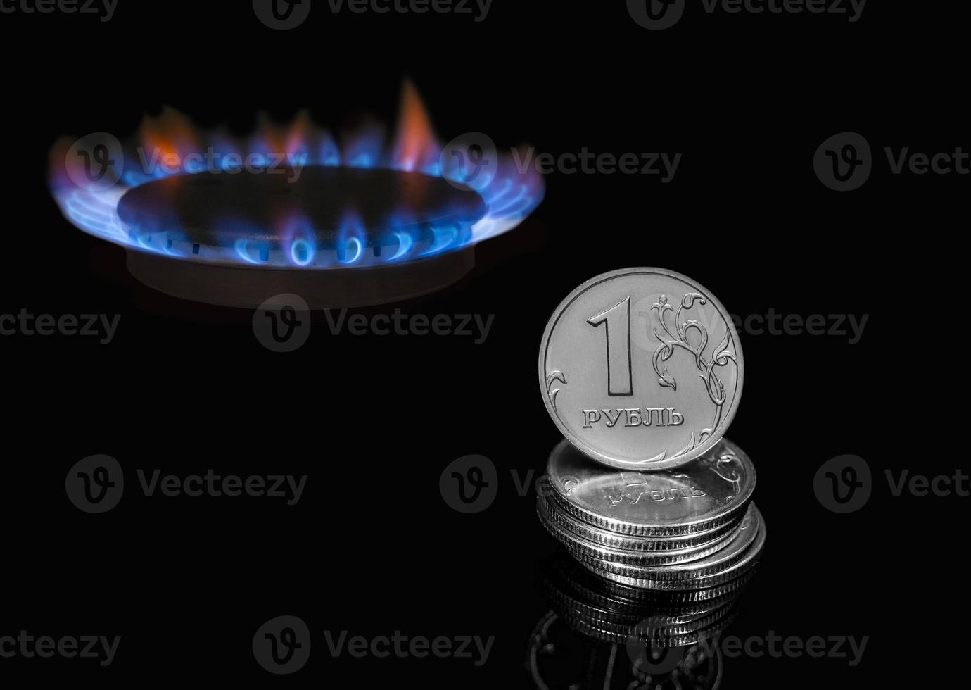 Gas burner and Russian rubles, the economy of Russia and Europe.The concept of selling natural gas for Russian rubles. The inscription on the coin is One ruble. Nord Stream photo
