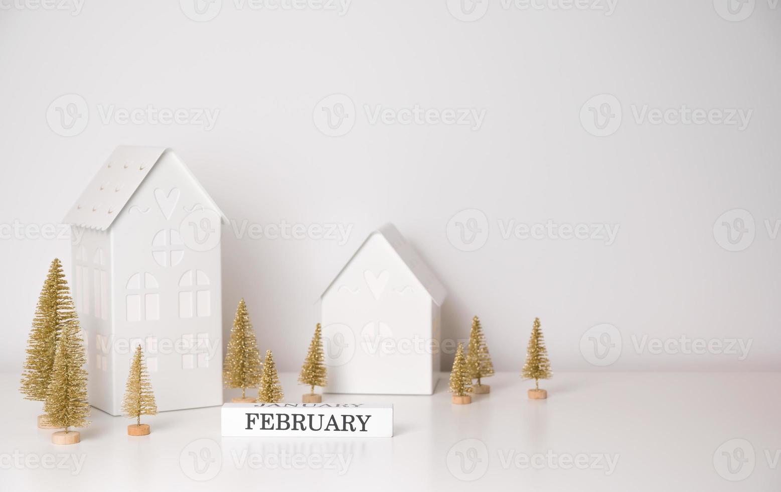Winter season banner with cozy decorations in white and golden. February sign photo
