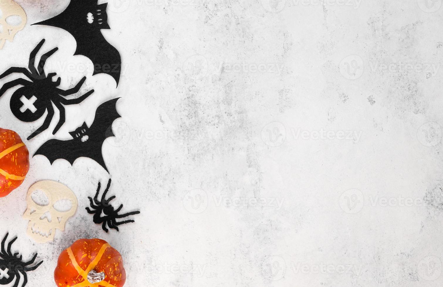 Copyspace halloween banner with place for text. Pumpkins,bats and spiders flat lay.Selective focus photo