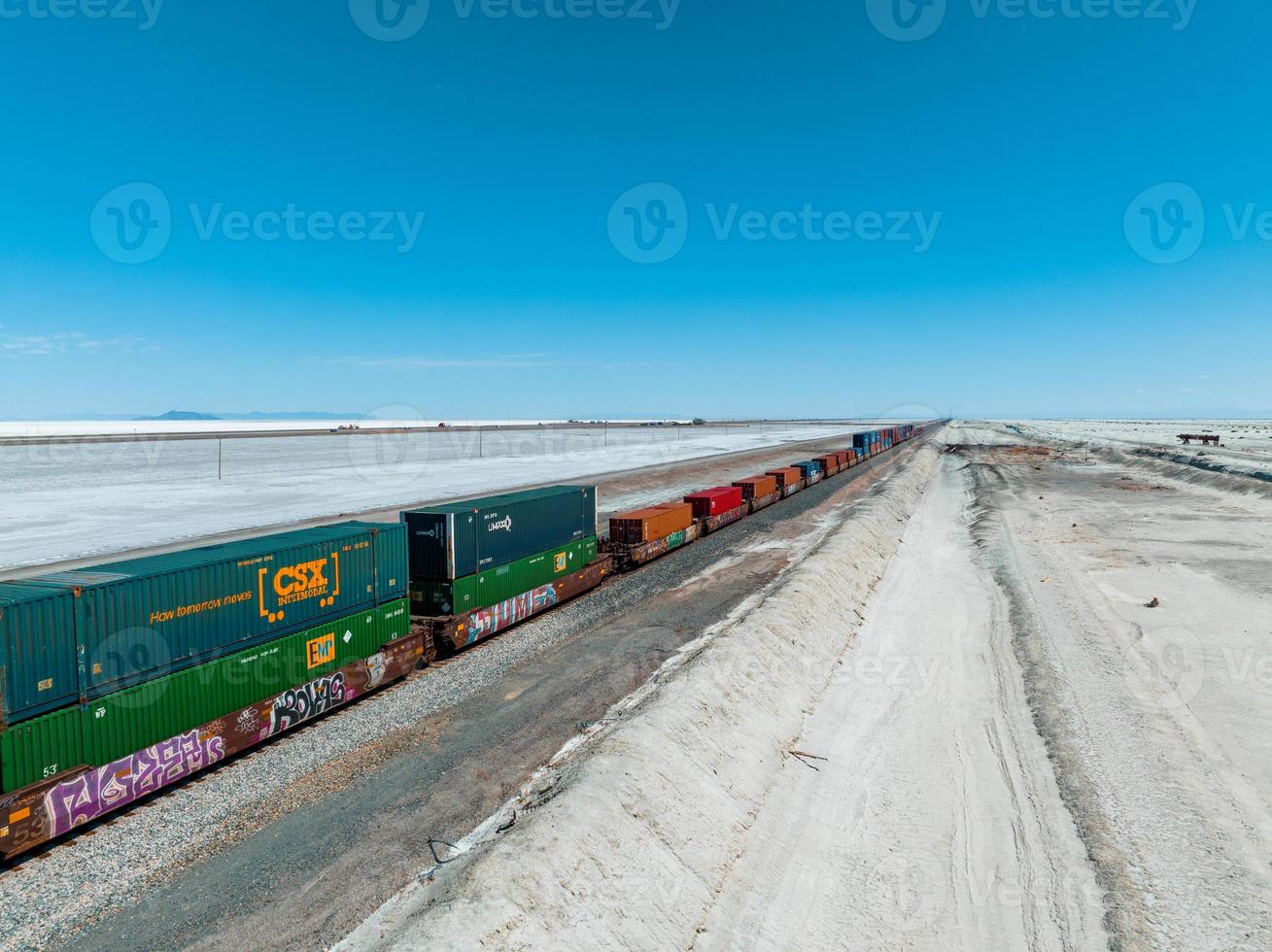 Cargo train passing by the desert Nevada, USA near Salt Flats. photo