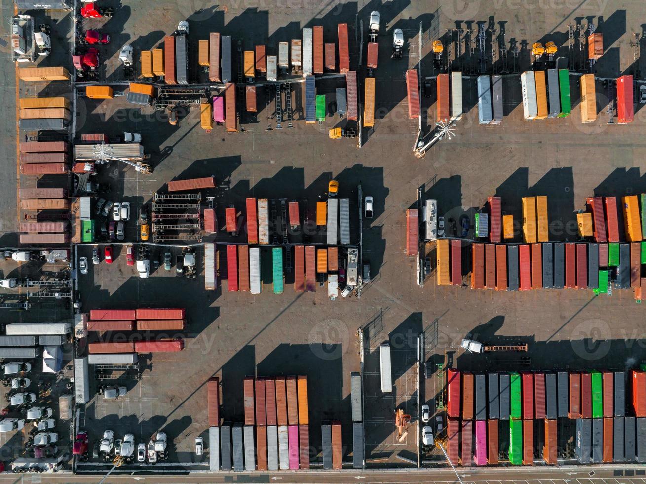 The Oakland Outer Harbor aerial view. Loaded trucks moving by Container cranes. photo