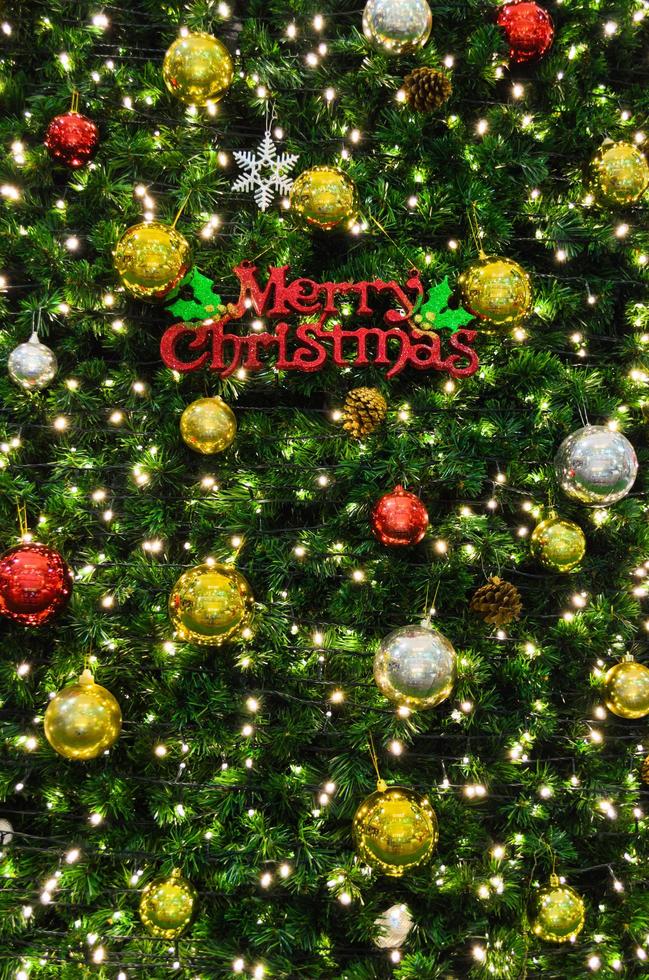Merry Christmas sign on the tree photo