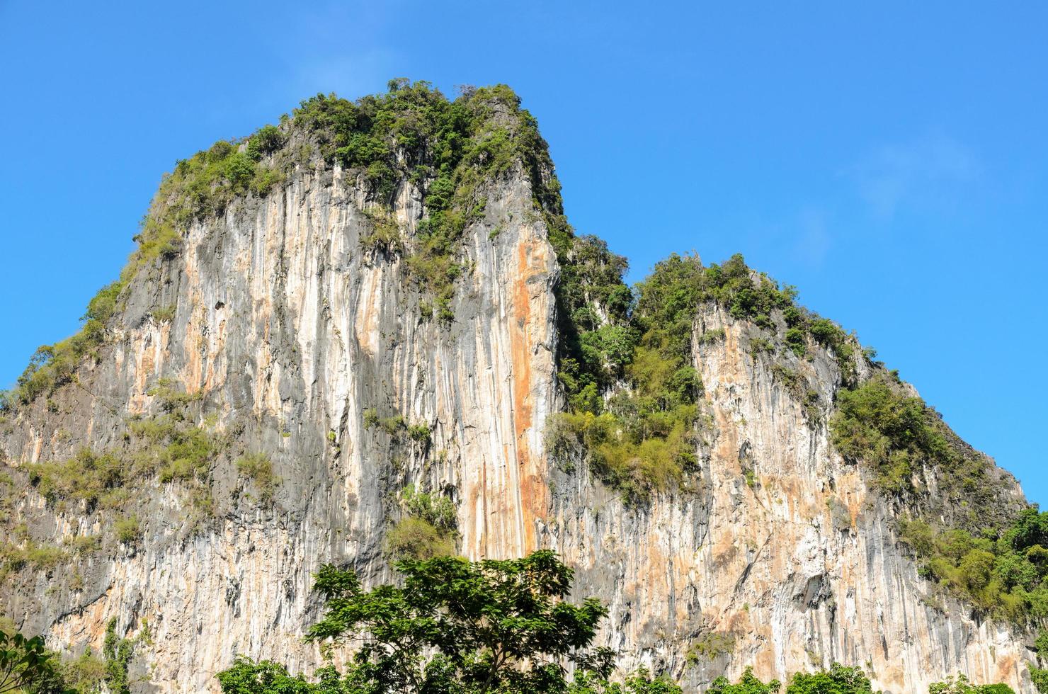 High cliffs on blue sky photo