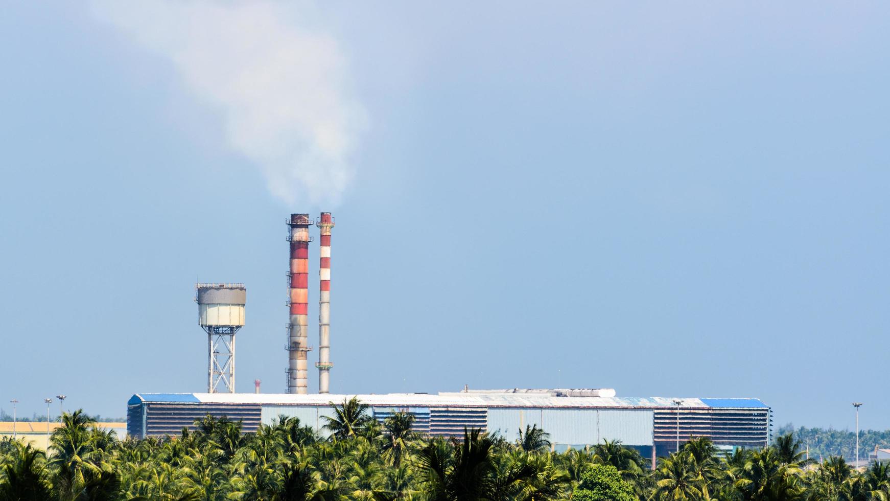 Old factory small with smoke stacks photo