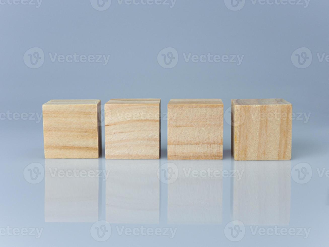 empty wooden blocks lined up on a white background. Business concept. photo