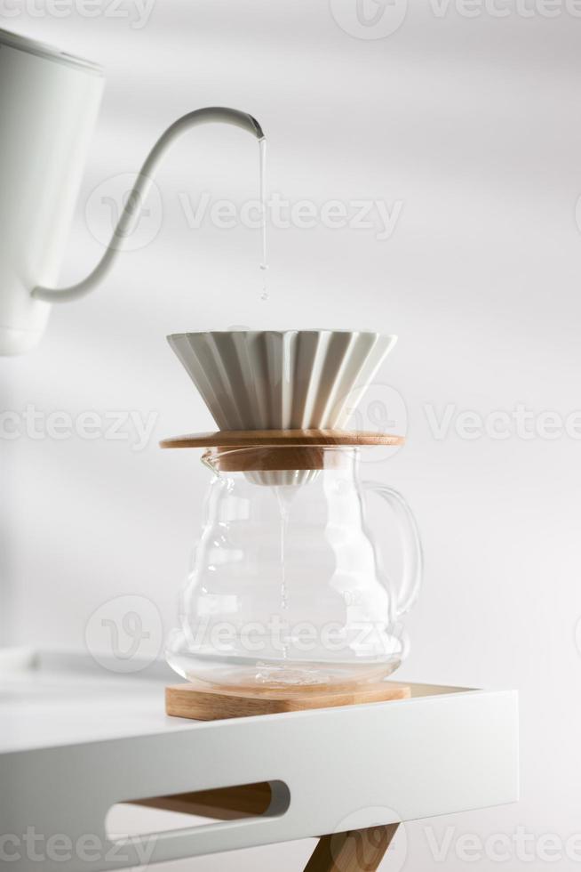Clean the filter paper before drip coffee photo