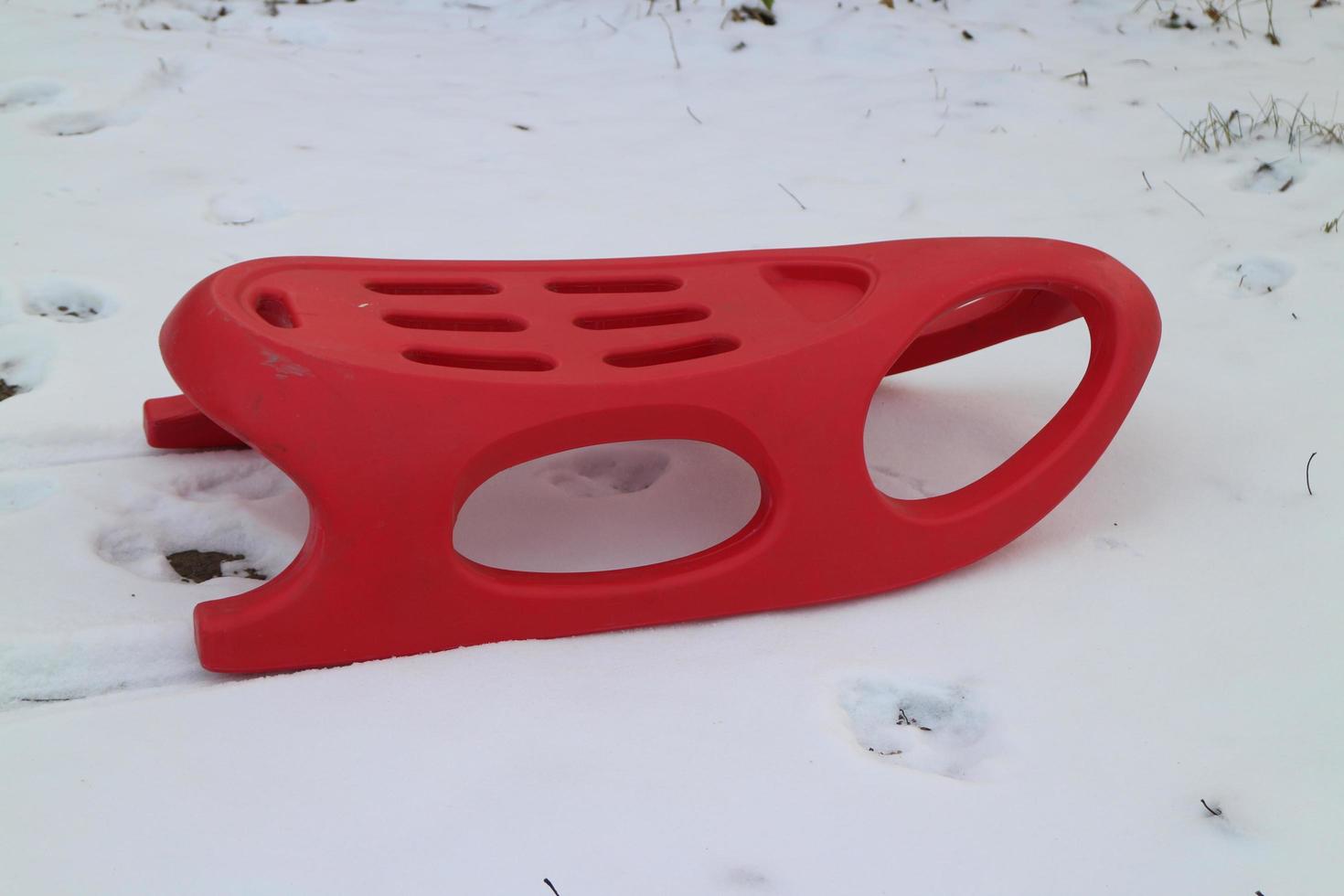 red bob sleigh on white snow photo