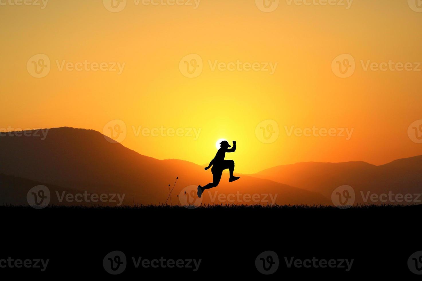 happy man running jumping in the meadow photo