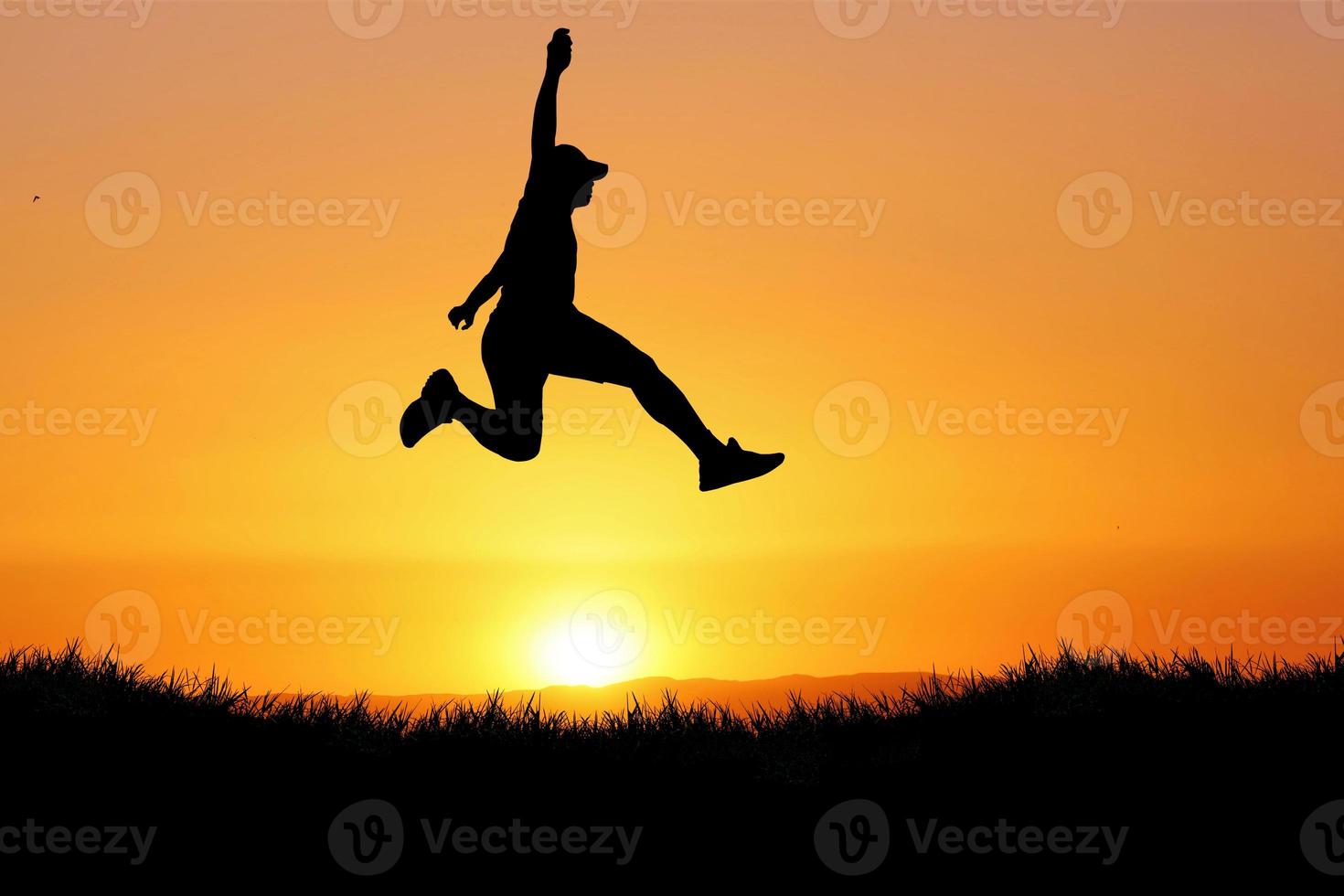 Silhouette of a man jumping. The concept of skipping, passing, moving forward. photo