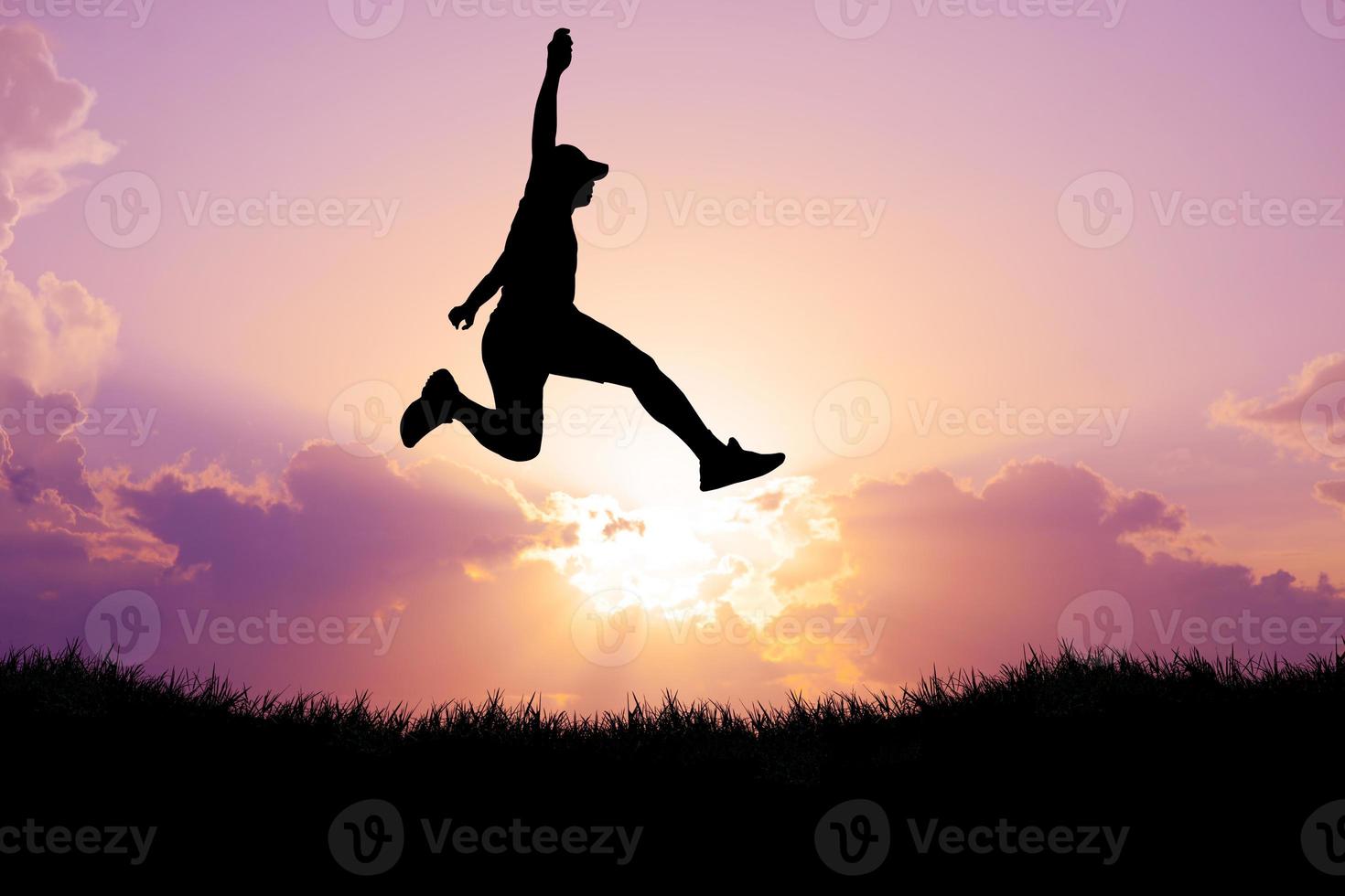 Silhouette of a man jumping. The concept of skipping, passing, moving forward. photo