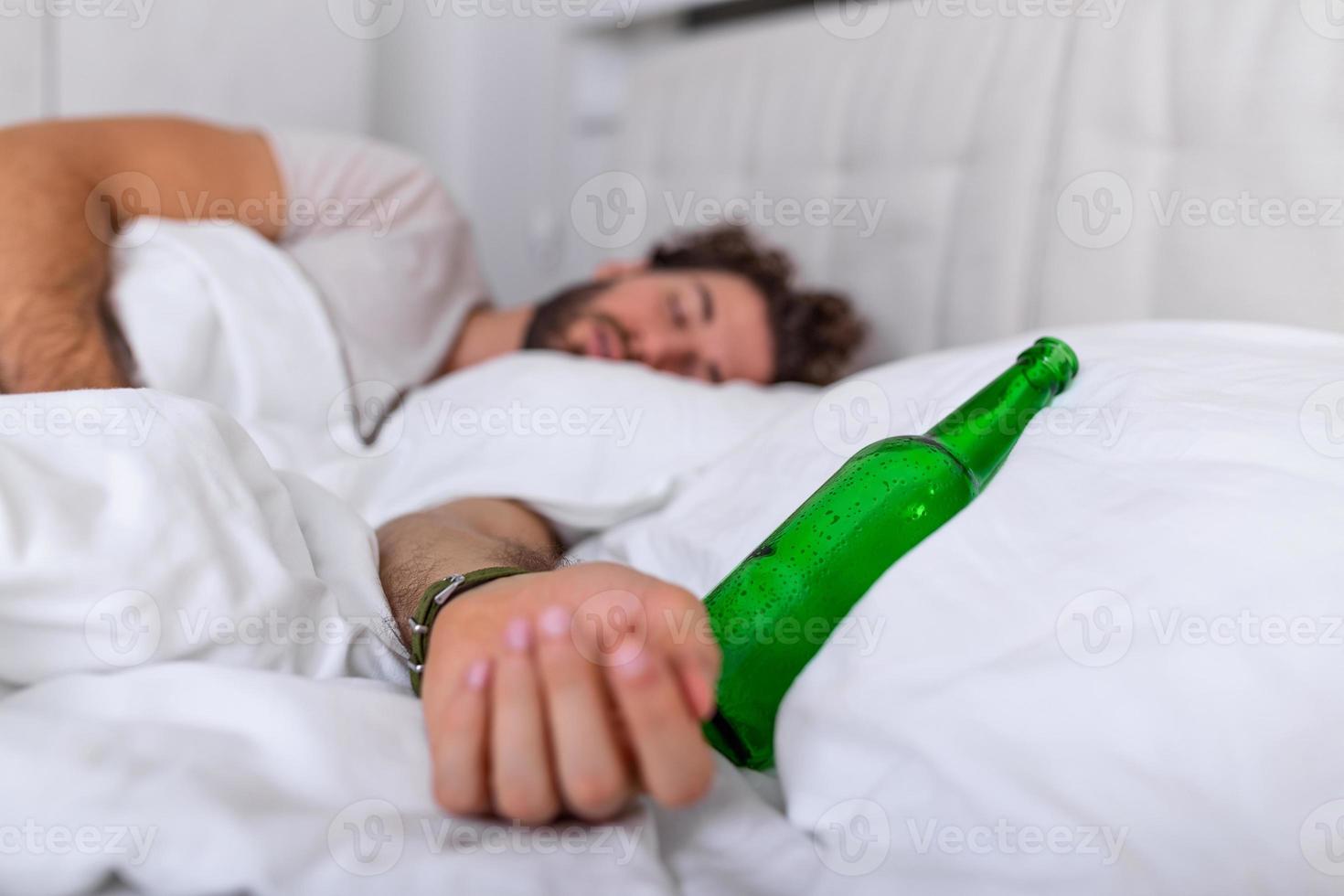 After drinking. Drunk bearded adult man lying on the bed and sleeping