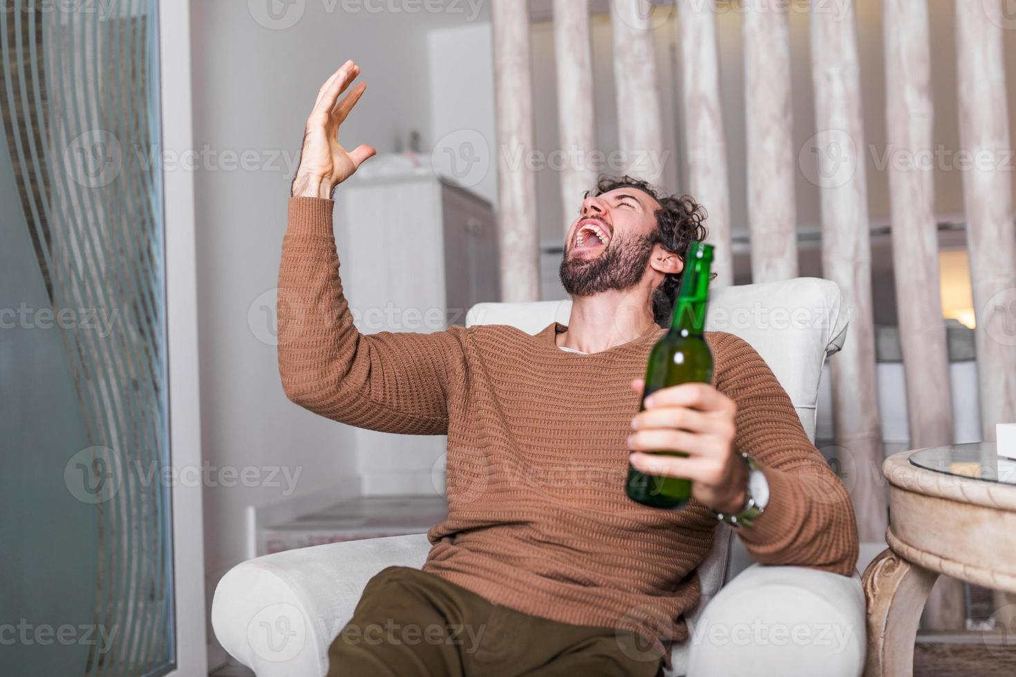 Go, team, go The true fan never misses a game. Sports, happiness and people concept - smiling man watching sports on tv and supporting team at home. Go, team, go photo