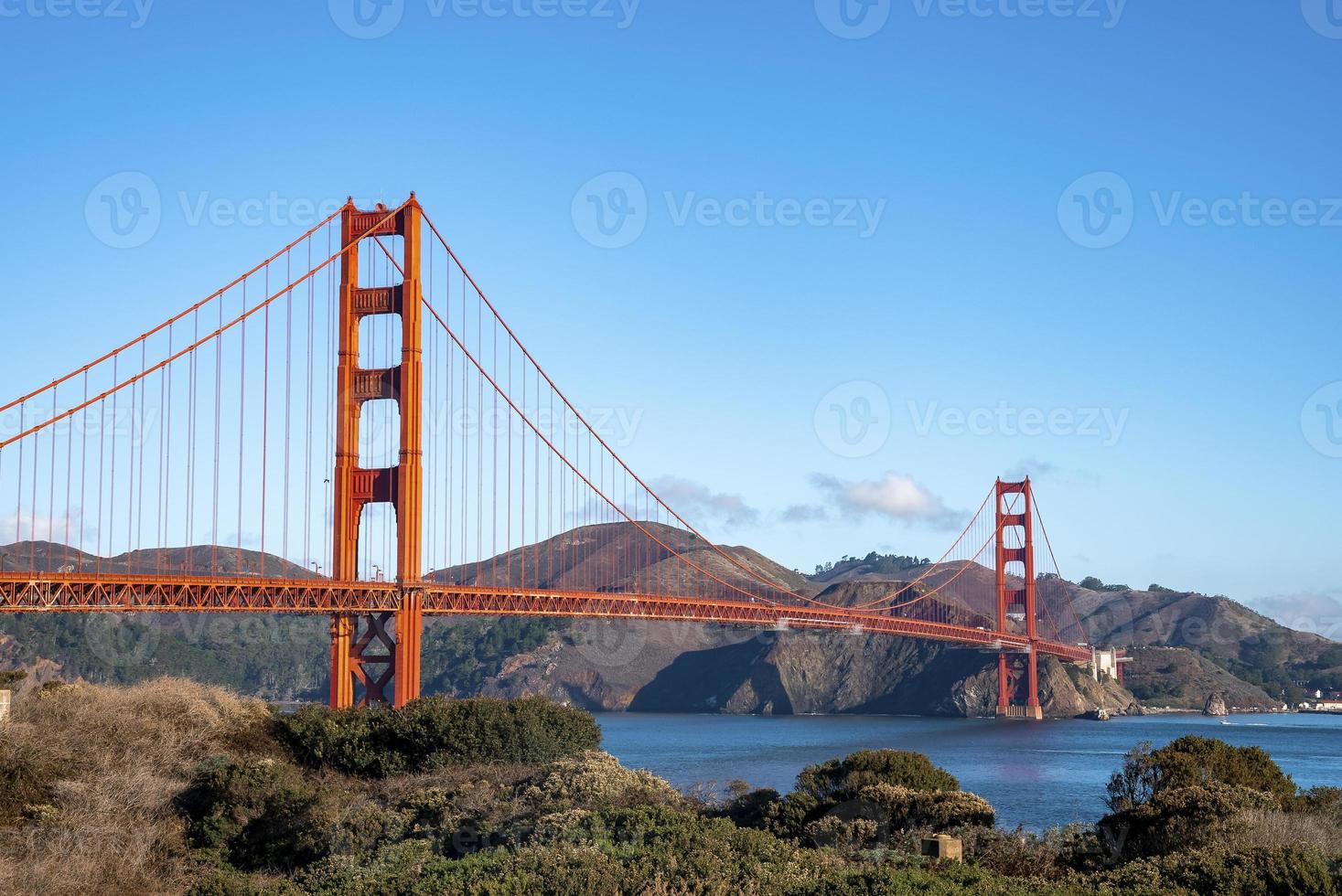 Golden Gate Bridge over beautiful San Francisco Bay on sunny day photo