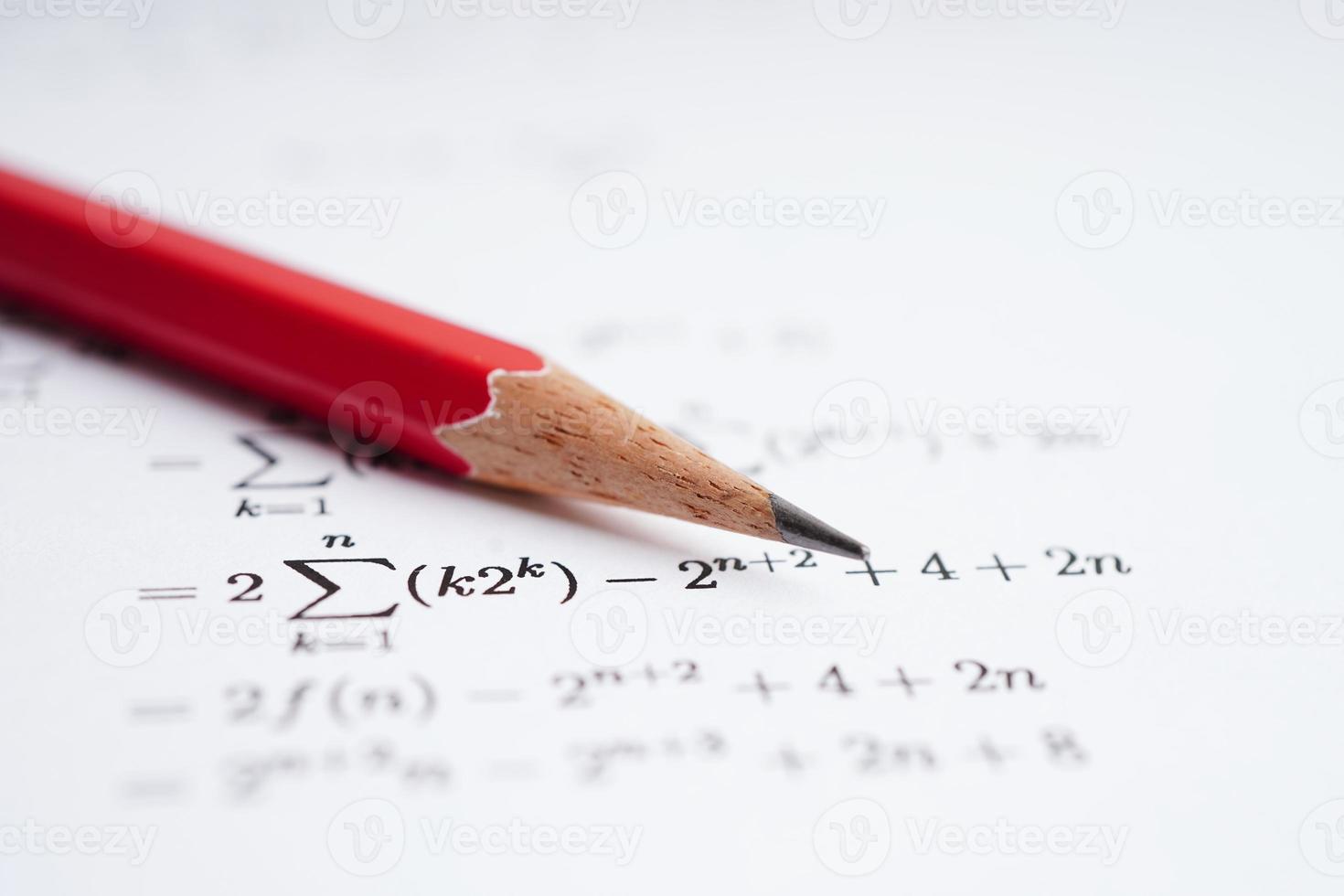 Pencil on mathematic formula exercise test paper in education school. photo