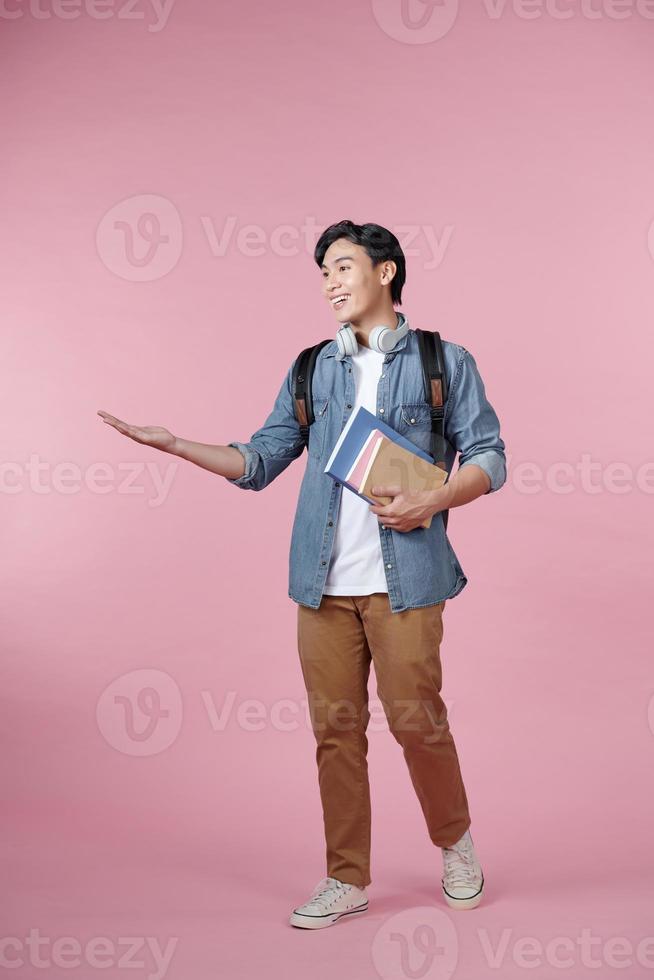 Young student man happy for understand something over isolated pink background photo