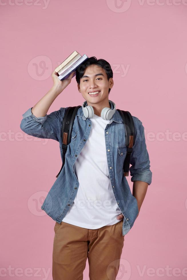 Cool millennial student smiling and looking at camera photo